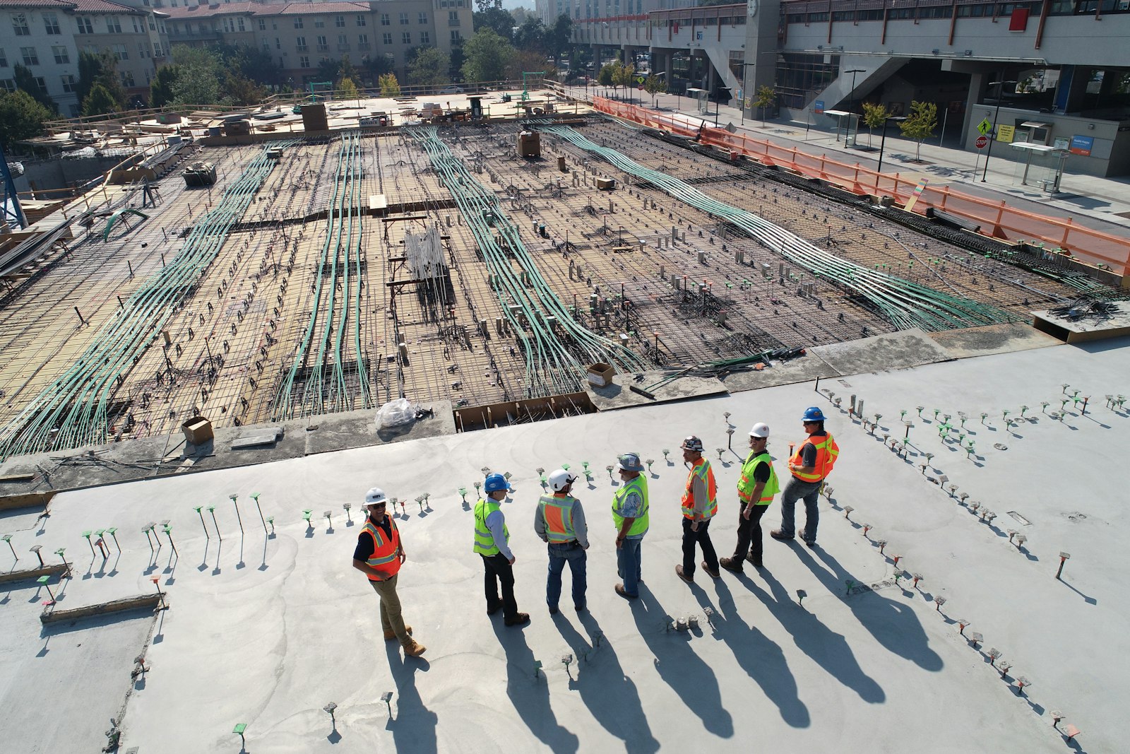 Active construction site with scaffolding and equipment